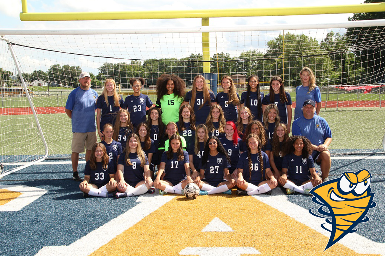 girls soccer team team with coach