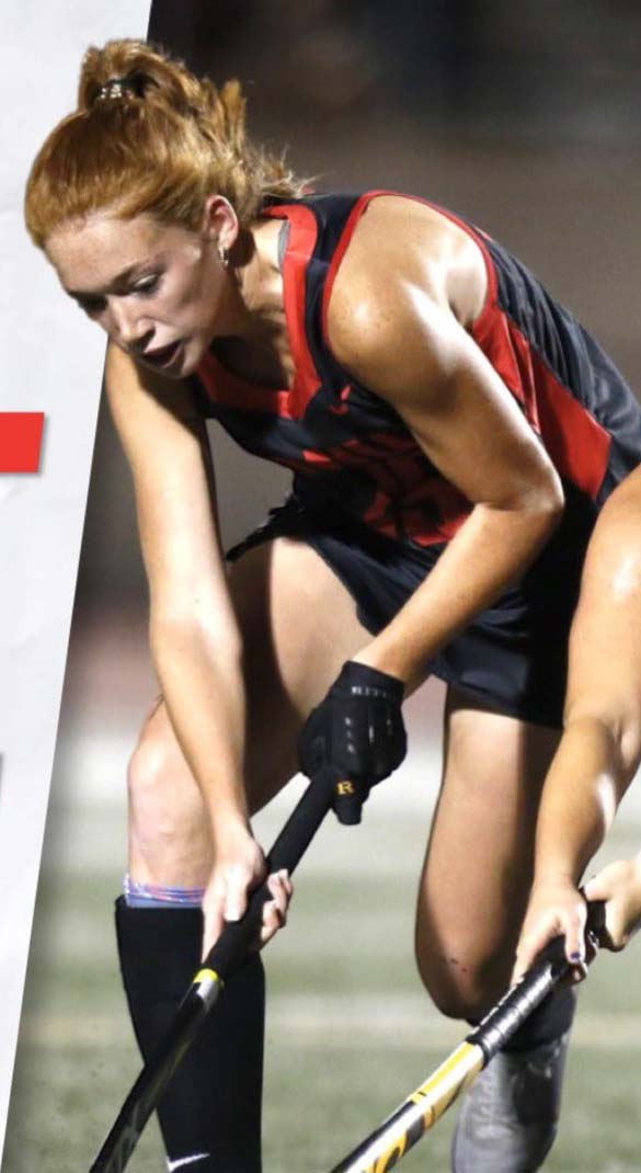 student playing field hockey